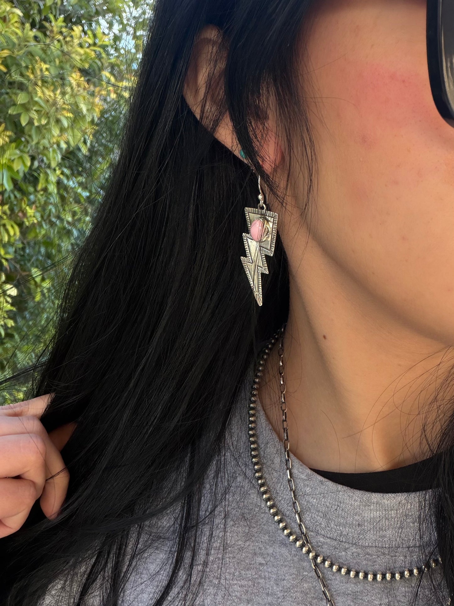 Pink conch lighting bolt earrings