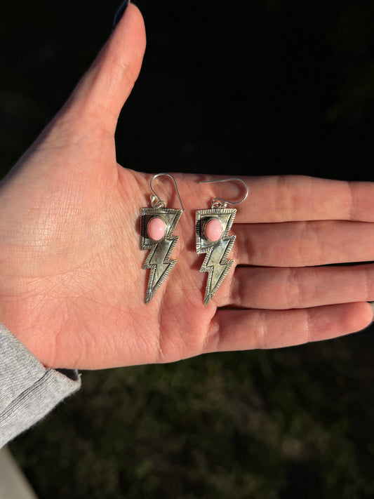 Pink conch lighting bolt earrings